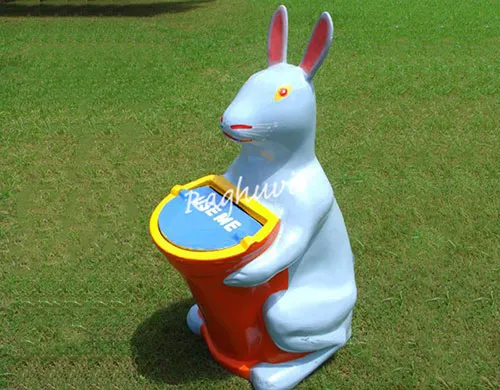 outdoor white rabbit with red container waste bin
